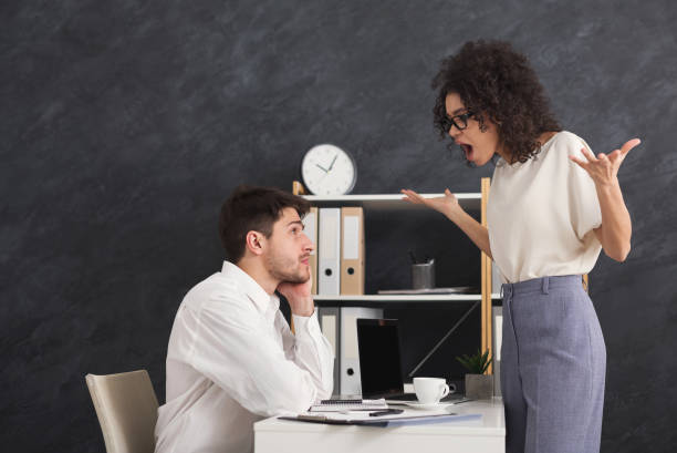 istock Couple of young colleagues arguing at office 961710702