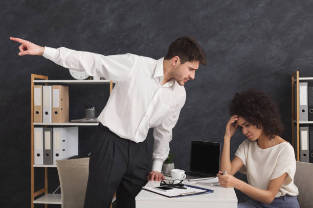 Angry boss firing his assistant secretary