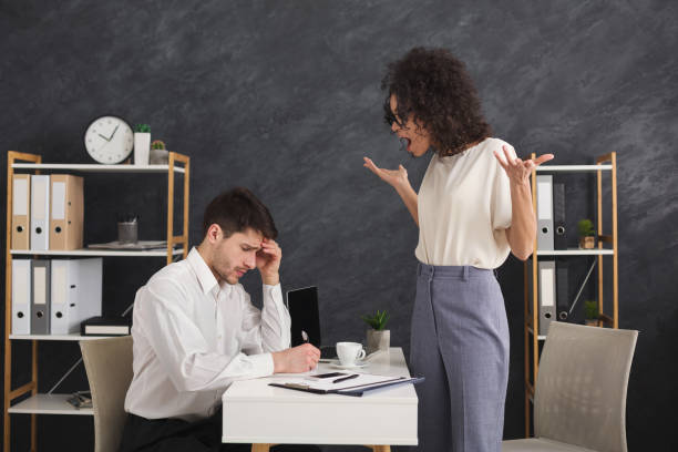 istock Couple of young colleagues arguing at office 961713038