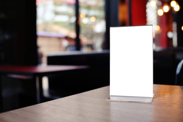istock Mock up Menu frame standing on wood table in Bar restaurant cafe. space for text 961714212