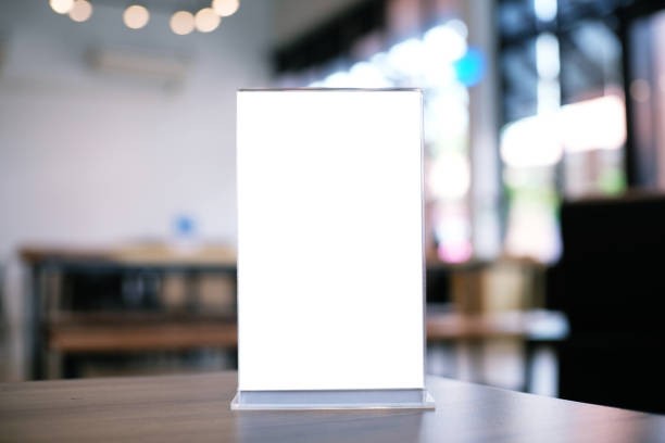 istock Mock up Menu frame standing on wood table in Bar restaurant cafe. space for text 961714468