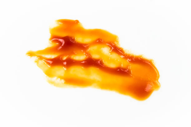 istock Tomato sauce isolated on white background. Red ketchup splashes isolated on white background, top view 961714532