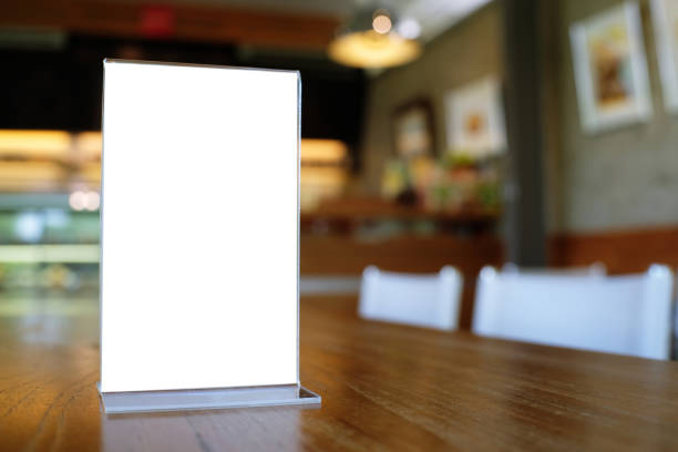 istock Mock up Menu frame standing on wood table in Bar restaurant cafe. space for text 961714662