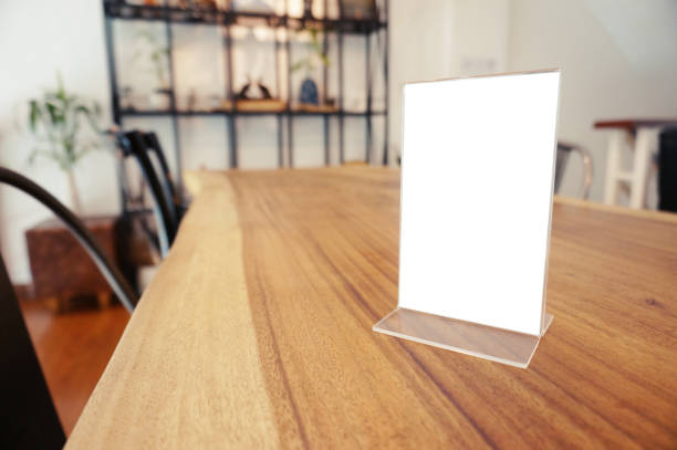 istock Mock up Menu frame standing on wood table in Bar restaurant cafe. space for text 961715012