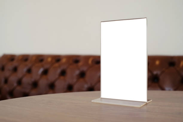 istock Mock up Menu frame standing on wood table in Bar restaurant cafe. space for text 961715224
