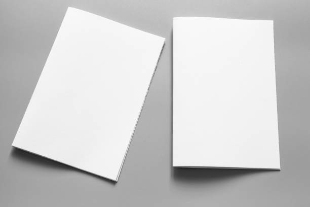 istock Blank portrait mock-up paper. brochure magazine isolated on grey, changeable background / white paper isolated on grey 961715878