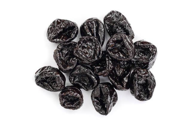 istock Dried plum - prunes isolated on a white background. Top view. Flat lay 961715986