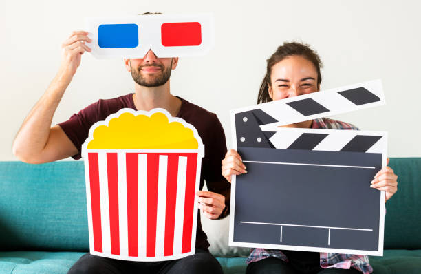 istock Couple watching movie at home together 961718318