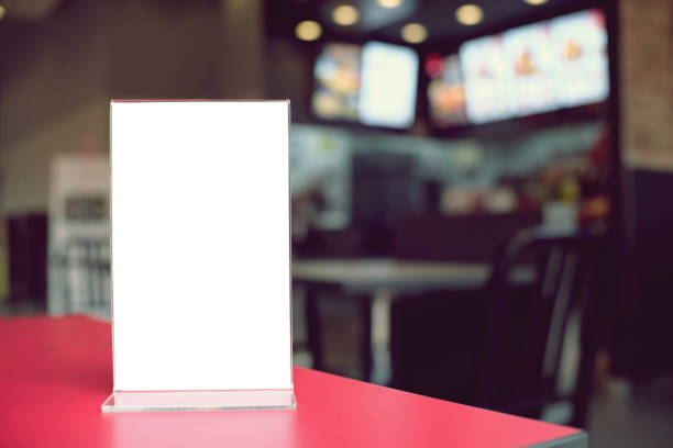 istock Mock up Menu frame standing on wood table in Bar restaurant cafe. space for text 961718352