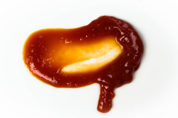 istock Tomato sauce isolated on white background. Red ketchup splashes isolated on white background, top view 961718460