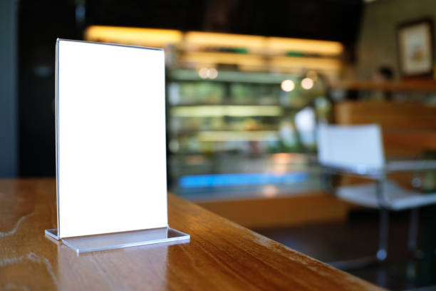 istock Mock up Menu frame standing on wood table in Bar restaurant cafe. space for text 961718718