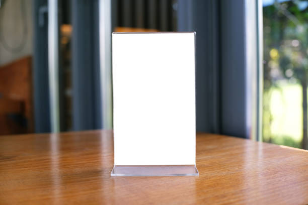 istock Mock up Menu frame standing on wood table in Bar restaurant cafe. space for text 961718738