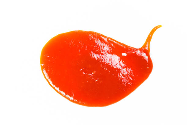 istock Tomato sauce isolated on white background. Red ketchup splashes isolated on white background, top view 961720160