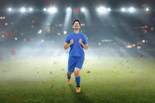 istock Young asian footballer man with happy expression 961720594