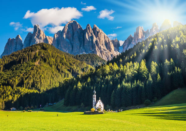 istock The sun illuminates green valley 961721038
