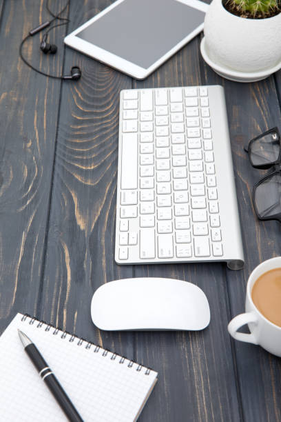 istock Modern workplace with smartphone and keyboard copy space on wood background. Top view. coffee cup. 961724182