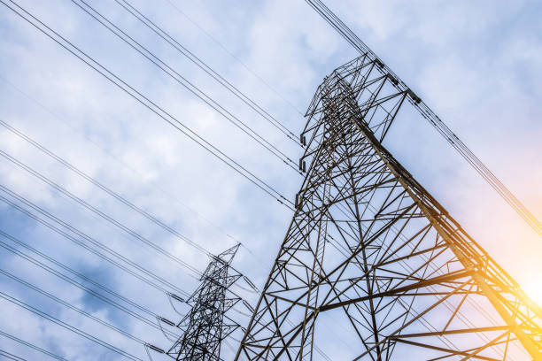 Electricity concept, Close up high voltage power lines station.  High voltage electric transmission pylon silhouetted  tower.