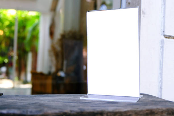 istock Mock up Menu frame standing on wood table in Bar restaurant cafe. space for text 961724488