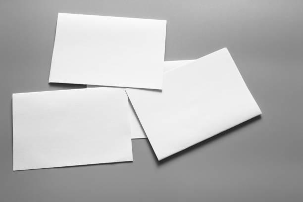 istock Blank portrait mock-up paper. brochure magazine isolated on grey, changeable background / white paper isolated on grey 961724494