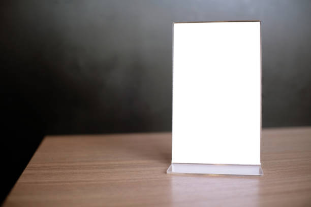 istock Mock up Menu frame standing on wood table in Bar restaurant cafe. space for text 961724520