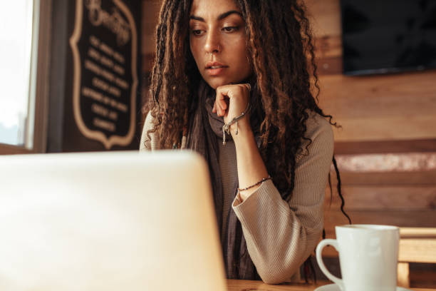 istock Woman entrepreneur working on laptop computer in a cafe 961725072