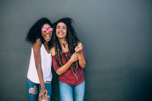 istock Women standing against a wall and posing 961725238