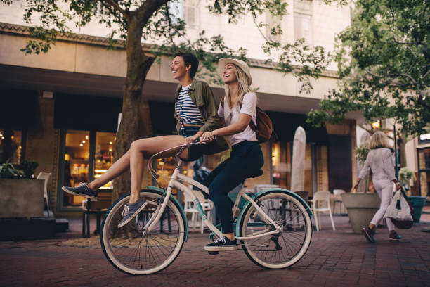 istock best friends enjoying bicycle ride 961725514