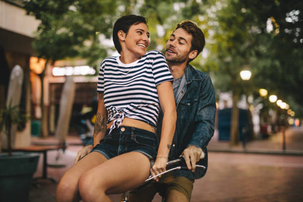 istock Couple enjoying on bicycle in the city 961725616