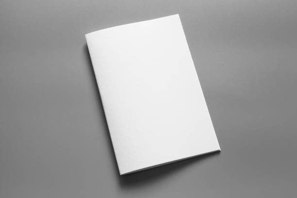 istock Blank portrait mock-up paper. brochure magazine isolated on grey, changeable background / white paper isolated on grey 961725654
