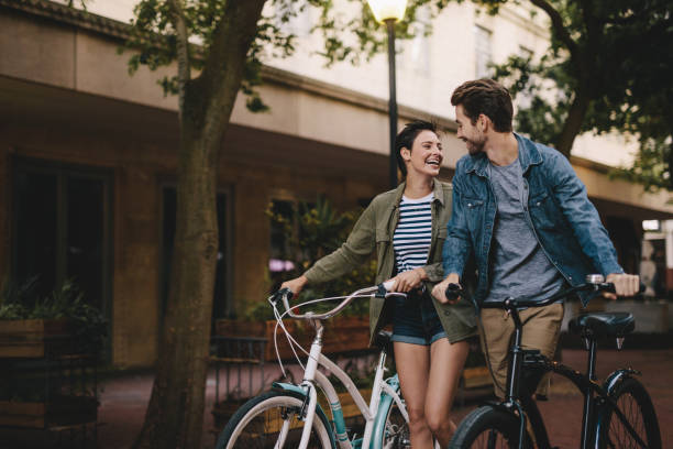 istock Couple with bicycles on the street 961725668