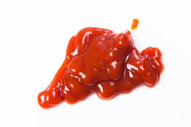 istock Tomato sauce isolated on white background. Red ketchup splashes isolated on white background, top view 961726134