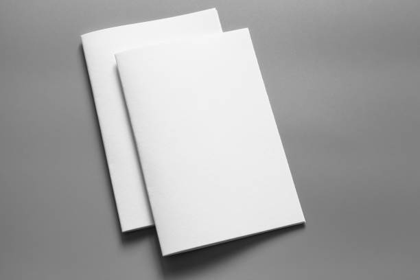istock Blank portrait mock-up paper. brochure magazine isolated on grey, changeable background / white paper isolated on grey 961726312