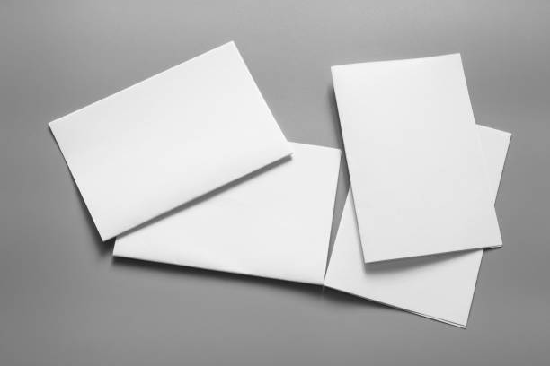 istock Blank portrait mock-up paper. brochure magazine isolated on grey, changeable background / white paper isolated on grey 961726412