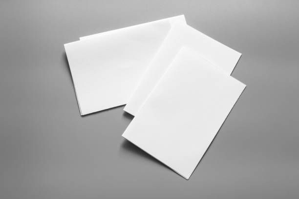 istock Blank portrait mock-up paper. brochure magazine isolated on grey, changeable background / white paper isolated on grey 961726634