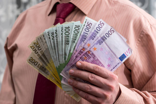 istock Fan from euro banknotes in male hands 961729370