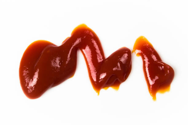 istock Tomato sauce isolated on white background. Red ketchup splashes isolated on white background, top view 961729614