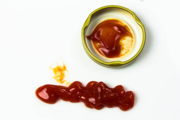istock Tomato sauce isolated on white background. Red ketchup splashes isolated on white background, top view 961730094