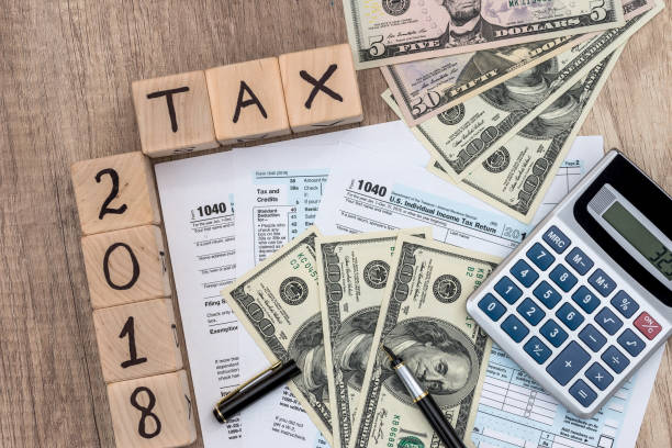 istock Time for tax paying, fiscal concept, 1040 form 961730300
