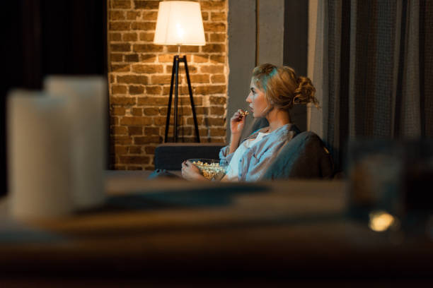 istock woman watching film at home 961730650