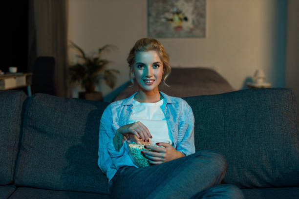 istock woman watching film at home 961730842