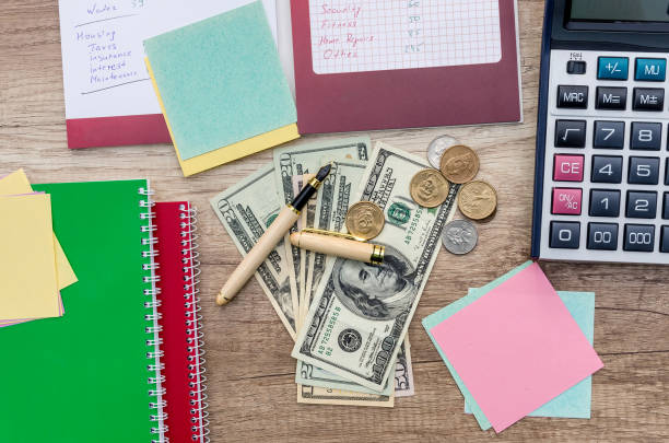 istock Family budget planning, dollar with pen and notepad 961730900