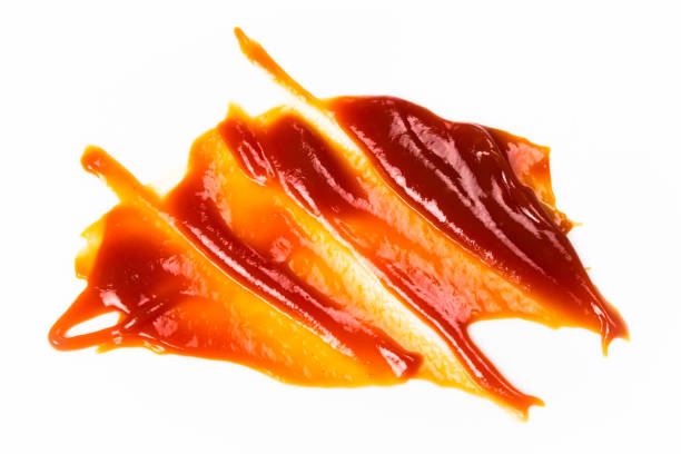 istock Tomato sauce isolated on white background. Red ketchup splashes isolated on white background, top view 961731248