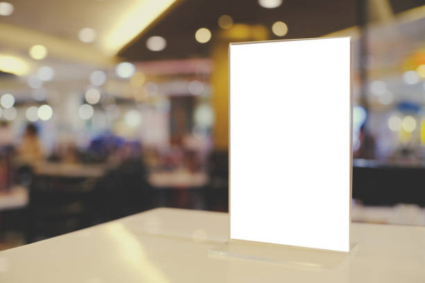 istock Mock up Menu frame standing on wood table in Bar restaurant cafe. space for text 961731292
