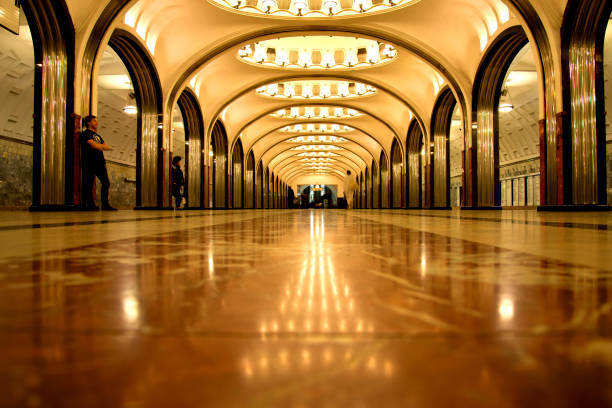Moscow, Russia, April 25th 2018: Commuters in Mayakovskaya Moscow metro station.\nThe station was built as part of the second stage of the Moscow Metro expansion, opening on 11 September 1938
