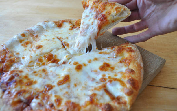 istock round pizza sour, sausages and vegetables 961732312