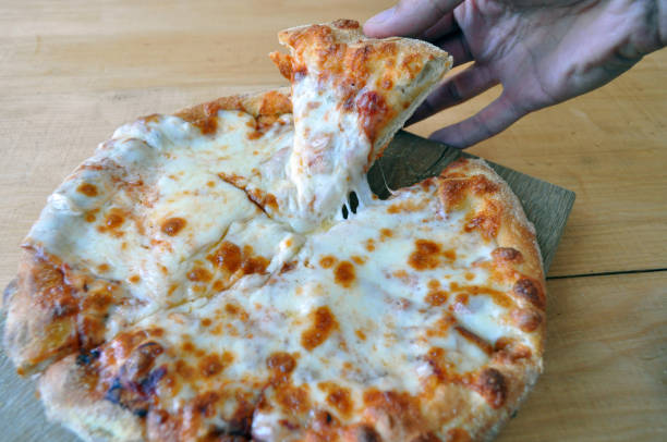 istock round pizza sour, sausages and vegetables 961732326