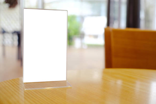 istock Mock up Menu frame standing on wood table in Bar restaurant cafe. space for text 961732644