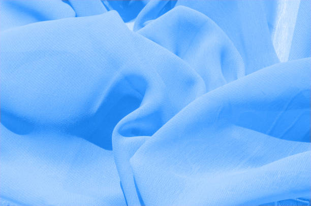 Background texture, pattern. Azure Blue Silk Twill. Here is a deluxe azure blue silk twill perfect for a vast array of applications. Almost as soft as a cloud, this remarkable silk has a supreme drape