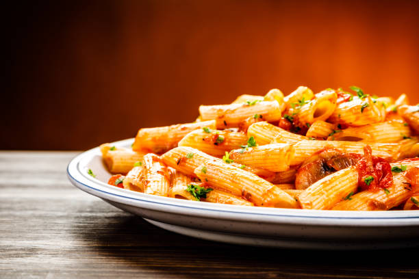 istock Penne with sauce and pork 961735526
