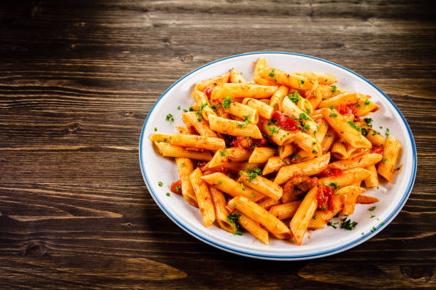 istock Penne with sauce and pork 961735604